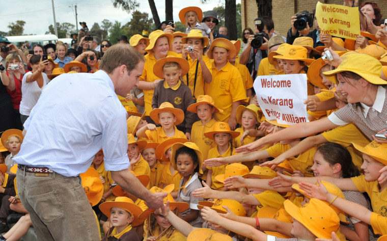 Image: Britain's Prince William greets Kerand South Primary School students